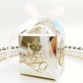 Detailed silver laser-cut candy box featuring Ganesha design and a white organza ribbon - Reflective Silver With White Ribbon