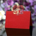 Elegant red laser-cut wedding place card with intricate floral bird patterns for tables - Pearlescent Red