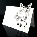White laser-cut place card with intricate butterfly and floral vine design on textured paper - White Butterfly Vine Hollow (XWK-32)