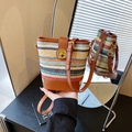 Colorful woven bucket bag with brown leather trim and golden twist lock closure - Multicolor Without Charm