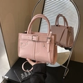 Pink faux leather handbag with silver rivets and detachable crossbody strap - Pink