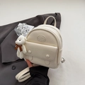 Mini vintage cream backpack with textured leather and a cute white bear charm - White