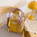 Handmade straw bucket bag with purple rope handles and a matching decorative bow detail - Purple