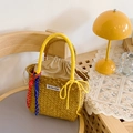 Handwoven straw bucket bag with vibrant yellow rope handles and a drawstring inner pouch - Yellow