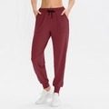 Women's burgundy loose yoga joggers with elastic waist and drawstring detail - S / Burgundy