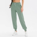 Pantaloni da yoga larghi verde fagiolo da donna con coulisse elastica e tasche laterali - Verde Muschio