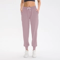 Women's drawstring jogging pants in dusty rose pink with elastic waist and ribbed cuffs - S / Bottoms / Pink Purple
