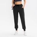 Pantalon de jogging noir pour femmes avec taille haute à cordon et poches latérales - S / Bas / Noir