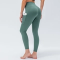 High-waisted women's yoga leggings in sage green with side pockets for phone storage - XS / Mysterious Green
