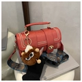 Retro red Boston barrel bag with gold rivets, ethnic strap and furry monster charm - Burgundy Red With Charm