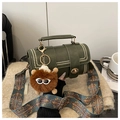 Dark green Boston bag with wide ethnic strap, gold studs, and brown plush charm - Green With Pendant