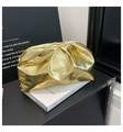 Macro shot of metallic gold pleated cloud clutch bag with smooth kiss-lock closure - Gold