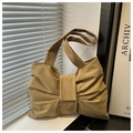 Detail of khaki tote bag featuring a large decorative bow and soft canvas texture - Khaki