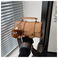 Detail of vintage brown crossbody bag featuring rivet accents and geometric print strap - Brown with Pendant