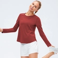 Women's dark brick red long sleeve athletic top with curved hem for yoga and running - S / Rust Red