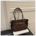Detail of a brown suede tote bag featuring a leather strap and metallic buckle detail - Coffee Without Pendant