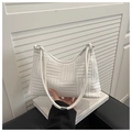 Detailed view of white woven shoulder bag texture with silver metal ring and zipper - White