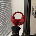 Red metallic shell bag with striped texture, round handle, and gold chain strap - Red