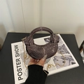 Brown acrylic shell bag with sculptural wave texture and golden chain strap for women - Coffee