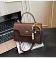 Retro dark brown patchwork handbag with wooden bead pendant and crossbody strap - With Pendant / Brown