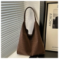 Detailed texture of brown leopard print hobo bag with soft velvet finish for winter - Brown