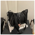 Close-up of a black punk-style saddle bag with silver rivets and magnetic buckle strap - Black