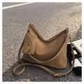 Detail of vintage brown bucket bag with lychee texture and mini envelope pouch charm - Brown With Small Pouch