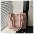 Detail of pink tote bag with star and moon patterns and golden metal chain strap - Pink Without Charm