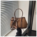Brown vintage suede handbag with stylish leather trim and decorative ribbon detail - Brown