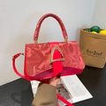 Red crossbody bag with gold buckle, letter patterns and decorative silk ribbon handle - Red