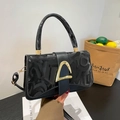 Chic black crossbody bag with embossed texture and gold D-buckle detail for women - Black