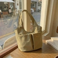 Minimalist light khaki canvas tote bag with double front pockets and soft fabric texture - Khaki