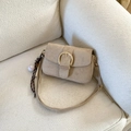Beige faux suede crossbody bag with gold round buckle and baseball pendant charm - Khaki With Pendant