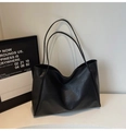 Detailed macro view of minimalist black leather tote bag showing fine texture and stitching - Two-piece Set(5999660005609) / Black