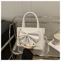 White square leather handbag with large bow, gold chain and pearl strap decoration - Black
