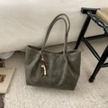Olive green suede tote bag with decorative wooden beads on textured gray background - Green Without Pendant