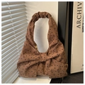 Close-up of brown corduroy bag showing pleat handle and heart bow print details - Brown