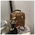 Close-up of leopard print handbag with magnetic closure and cute bunny doll pendant - With Pendant / Brown