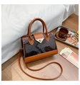 Detail of a brown crocodile-patterned mini handbag with a golden triangle lock - Brown