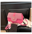 Pink crossbody bag with striped flap and gold geometric lock for stylish women - Pink
