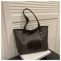 Detail view of large brown monogram tote bag with embossed M logo and slim shoulder straps - No Pendant / Brown