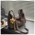Close-up of wide strap with silver buckle and plush bear charm on a brown hobo bag - Coffee with Pendant