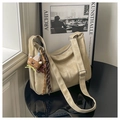 Detail of beige hobo shoulder bag with plush bear charm and adjustable wide strap - Khaki With Pendant