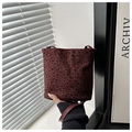 Detail of burgundy leopard print bucket bag made of soft faux suede material - Red Without Charm