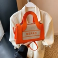 Chic orange and beige canvas contrast bag with BEPRO logo for crossbody or handbag style - Orange
