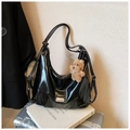 Glossy black hobo shoulder bag in faux leather featuring a cute brown bear charm - Black With Pendant
