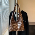 Brown leather hobo bag with silver rivet details and trendy underarm strap design - Brown