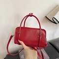 Fashionable red patent leather crossbody handbag featuring embossed FASHION lettering - Red