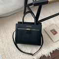 Chic black crossbody tote bag with gold hardware and textured finish on white rug - No Pendant / Black