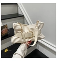 Detail of cream pleated leather bag with a gold square buckle and chain strap - White